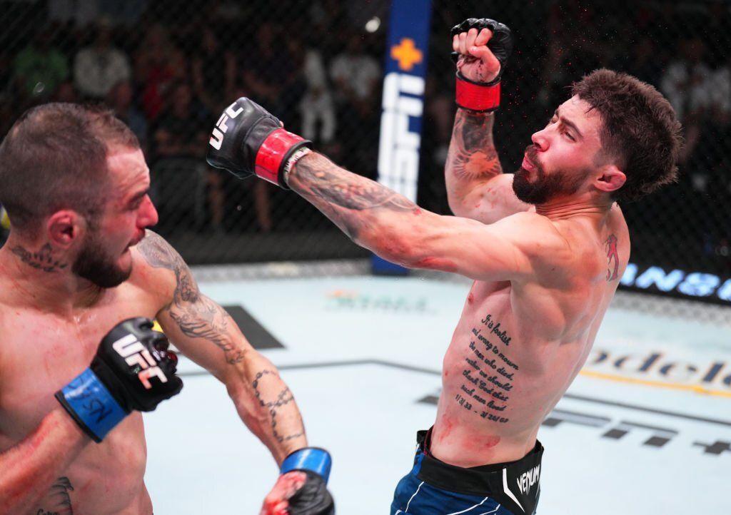 Lucas Almedia wobbles Mike Trizano. Credits to: Chris Unger of Getty Images.