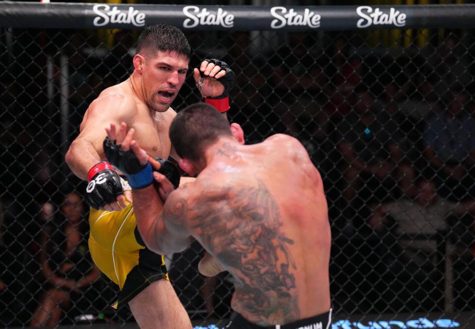 Vicente Luque kicking Rafael Dos Anjos in his last win. Credits to: Al Powers - Zuffa LLC.
