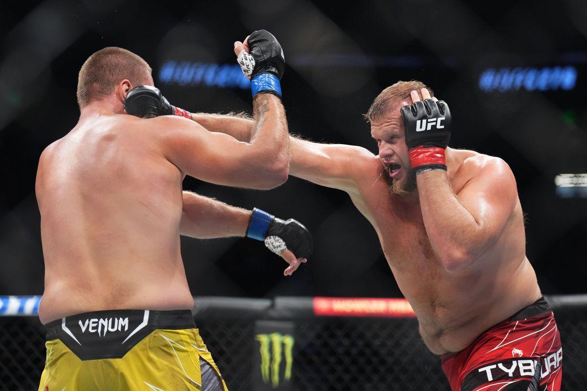 Marcin Tybura throws a right hand at Alexandr Romanov. Credit: MMA Fighting.