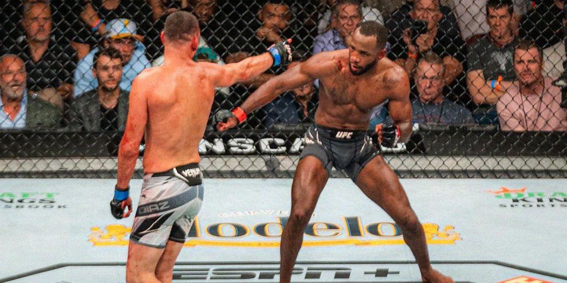 Nate Diaz points at Leon Edwards after rocking him. Credits to: Zuffa LLC