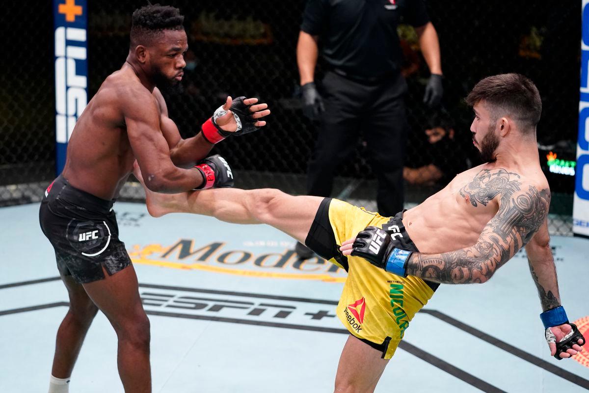 Matheus Nicolau throws a front kick at Manel Kape. Credit: MMA Fighting.
