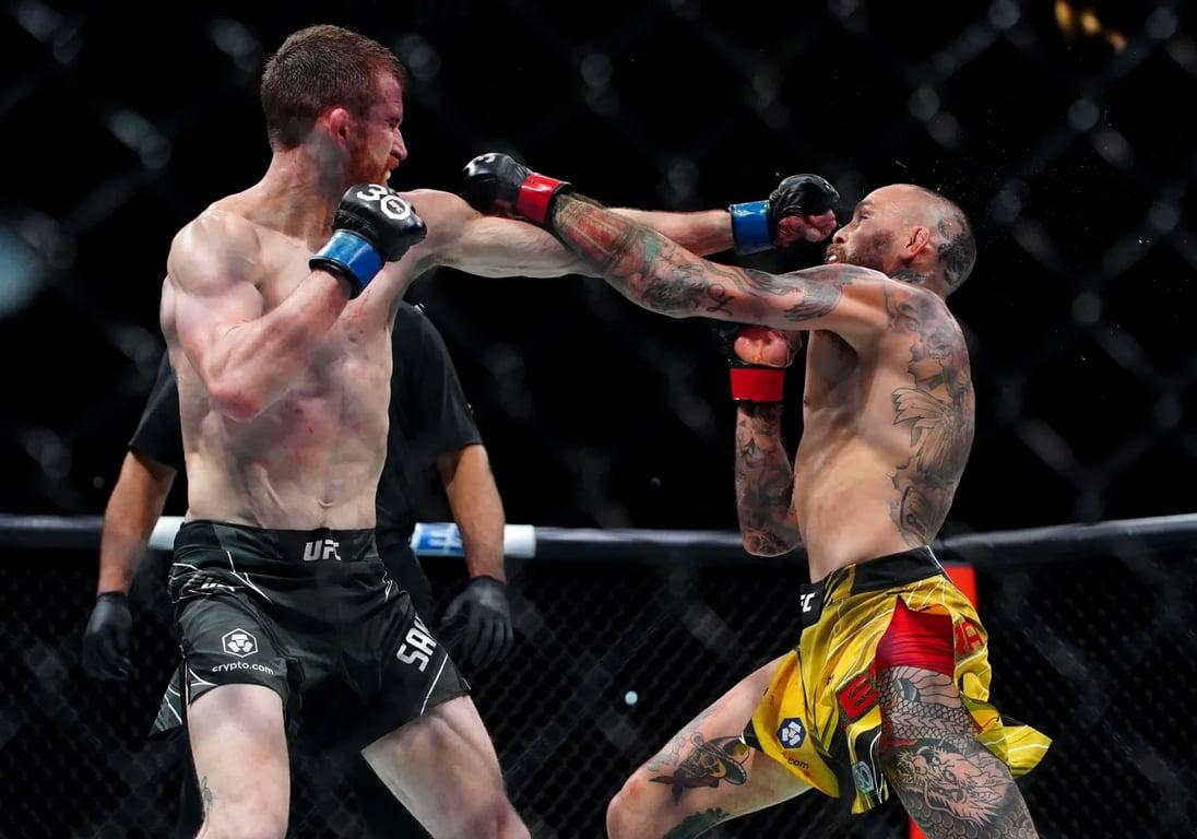 Cory Sandhagen landing a jab on Marlon Vera in their main event clash. Credits to: Aaron Meullion - USA TODAY Sports.