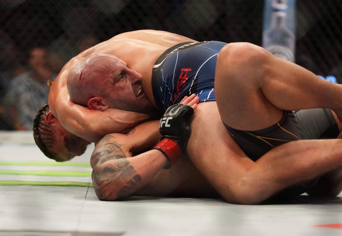 Ortega nearly submits the champion, Alex Volkanovski. Credits to: Cooper Neill