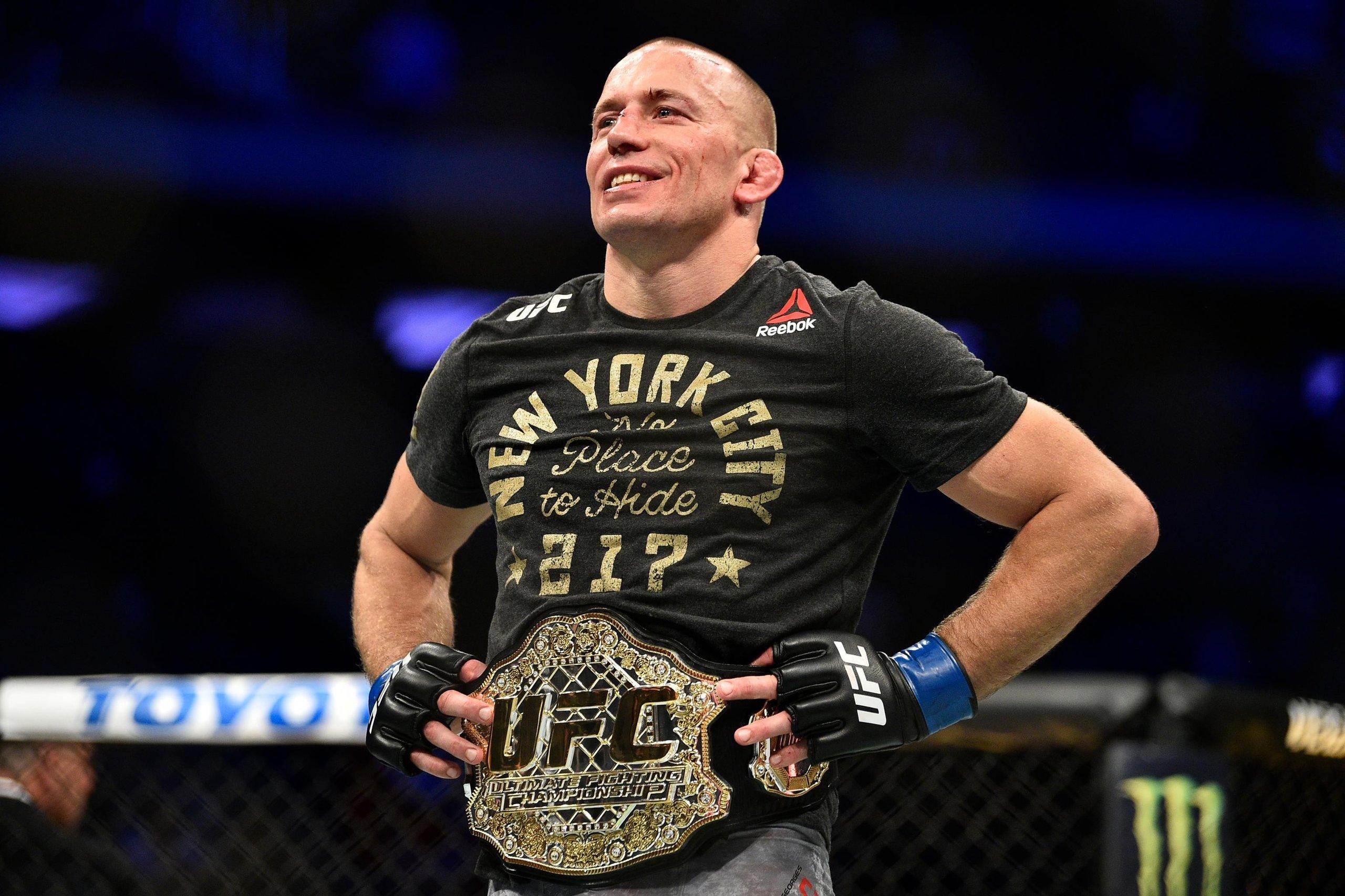 Georges St-Pierre celebrates his comeback victory for the UFC Middleweight title. Credit: Bleacher Report.