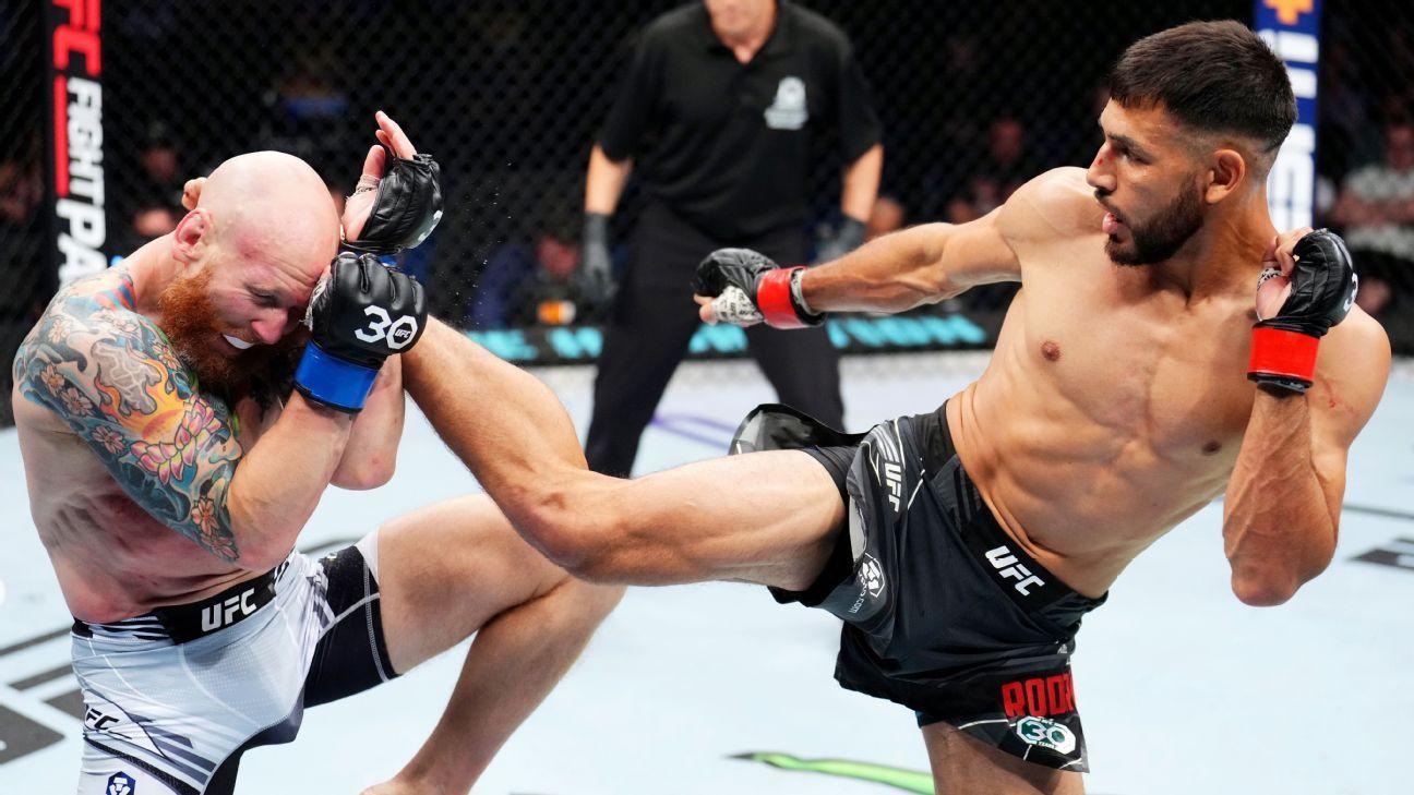 Yair Rodriguez attacking Josh Emmett with a headkick at UFC 284. Credits to: Brett Okamoto - ESPN.