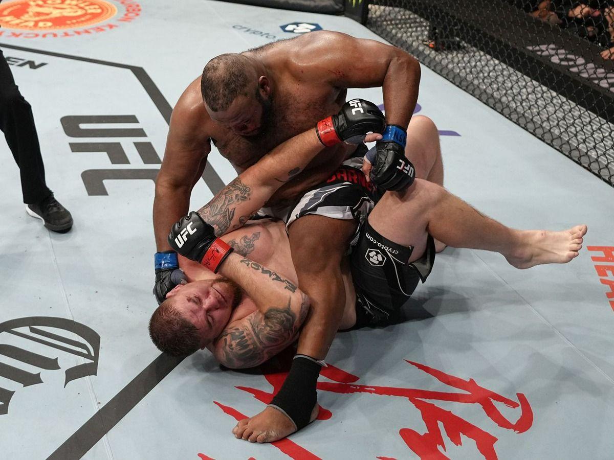 Chris Barnett rains down ground and pound onto Jake Collier. Credit: Zuffa LLC.