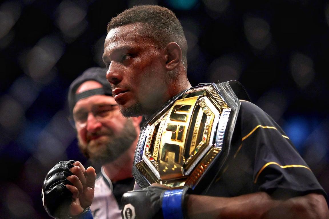 Jamahal Hill holding his belt. Credits to: Zuffa LLC.