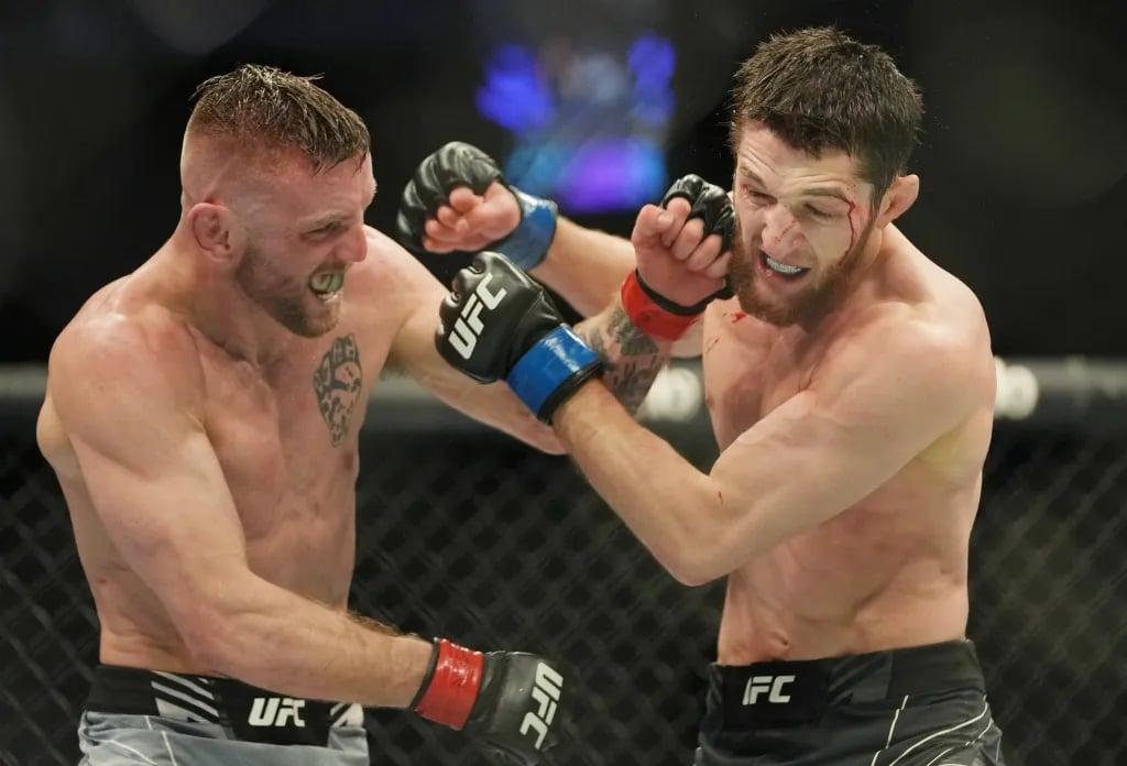 Tim Elliot scrapping with Tagir Ulanbekov at UFC 272. Credits to: Stephen R. Sylvanie - USA TODAY Sports.