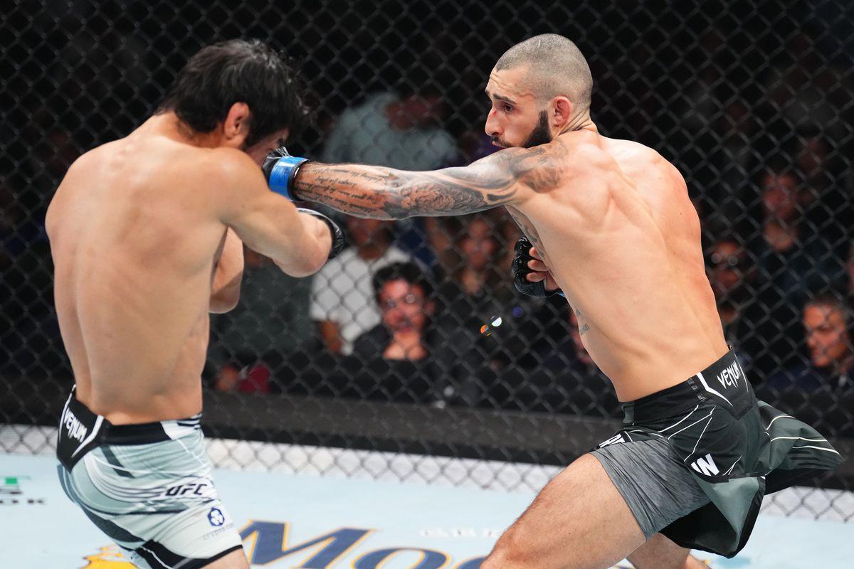 Charles Jourdain fires a left hook at Kron Gracie. Credit: MMA Fighting.