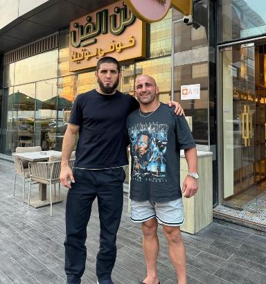Islam Makhachev and Alex Volkanovski take a picture the day after their fight
