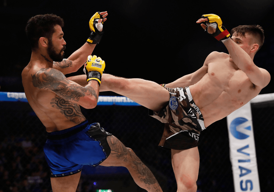 Nathaniel Wood striking with Vaughan Lee in his Cage Warriors debut. Credits to: Dolly Clew - Cage Warriors.
