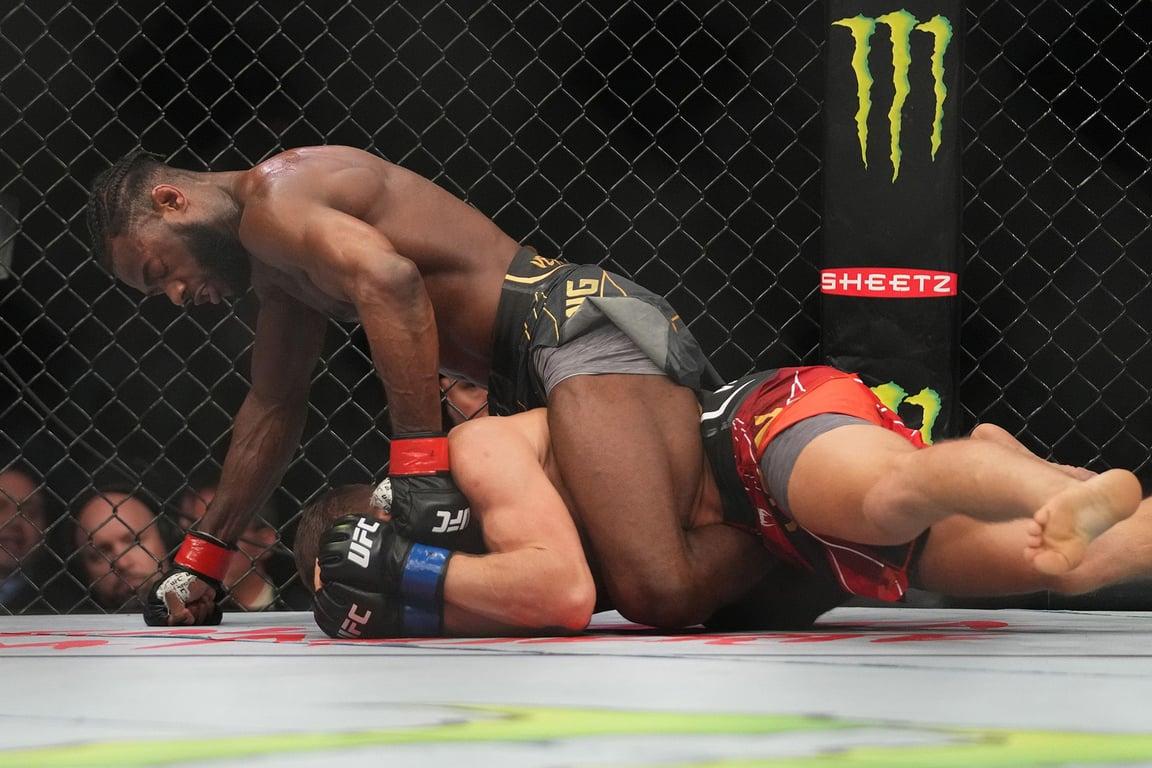 Aljamain Sterling ground-and-pounding Petr Yan at UFC 273. Credits to:  Cooper Neill - Zuffa LLC.