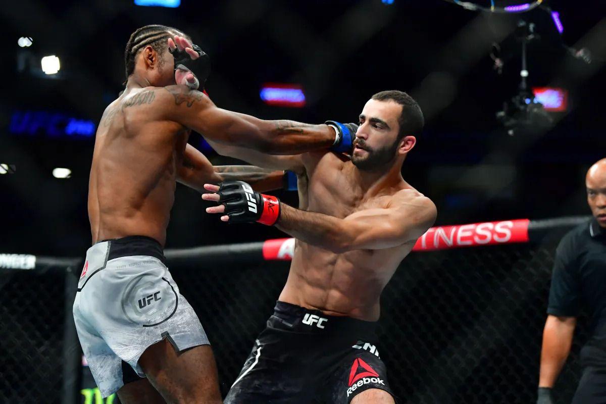 Jamall Emmers exchanges blows with Khusein Askhabov. Credit: MMA Junkie.