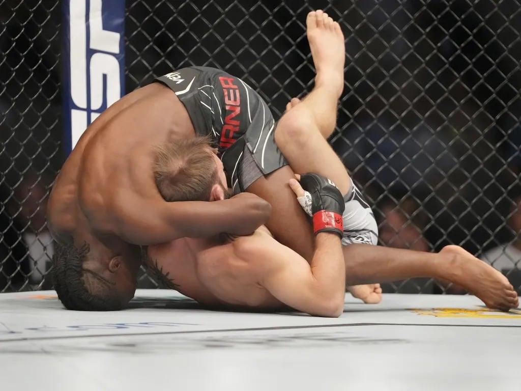Jalin Turner securing a first round submission of Brad Riddell at UFC 276. Credits to: Stephen R. Sylvanie - USA TODAY Sports.