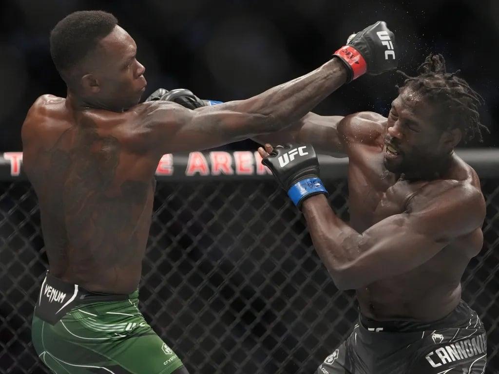Israel Adesanya and Jared Cannonier attempting strikes. Credits to: Mark J. Rebilas-USA TODAY Sports.