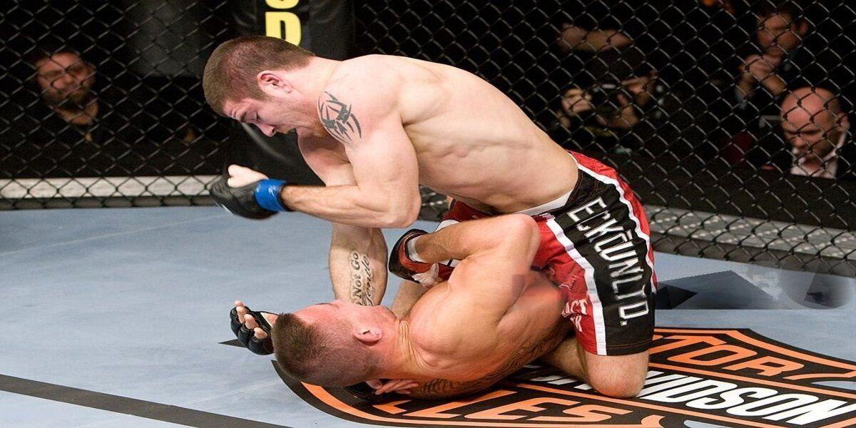 Jim Miller (red shorts) def. David Baron (black/flame shorts) - Submission (rear naked choke) - 3:19 round 3 during UFC 89 at The NIA on October 18, 2008 in Birmingham, England. (Photo by Josh Hedges/Zuffa LLC via Getty Images.