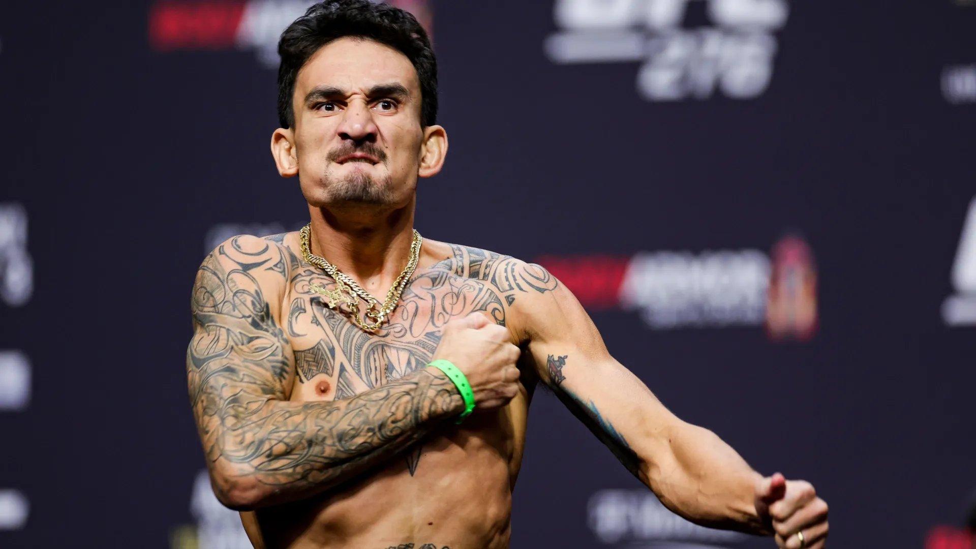 Max Holloway on the scale for the UFC 276 ceremonial weigh-ins. Credit: Carmen Mandato - Getty Images.