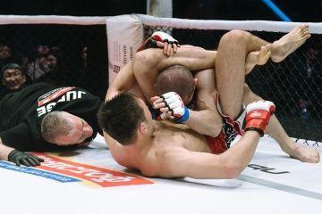 Shavkat Rakhmonov locks in the triangle choke on Levan Solodovnik. Credit: M-1 Global