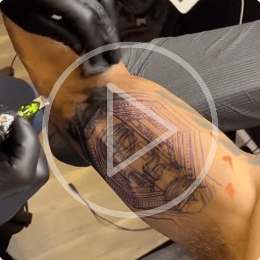 Alex Pereira gets a tattoo of the UFC Championship