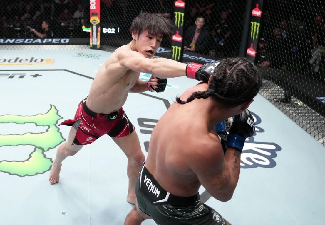 Tatsuro Taira punches CJ Vergara during the UFC Fight Night event at UFC APEX on October 15, 2022, in Las Vegas, Nevada. Credit: Jeff Bottari/Zuffa LLC.