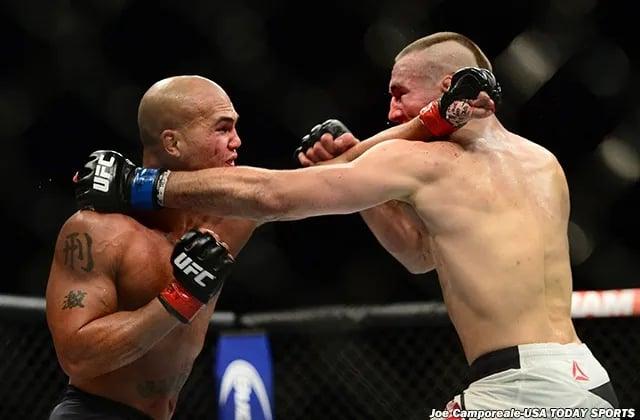Robbie Lawler and Rory MacDonald exchange punches. Credits to: Joe Camporeale, USA TODAY Sports.