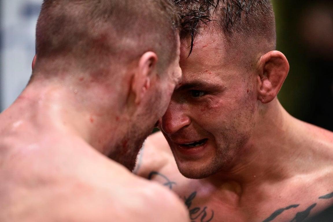 Dustin Poirier and Dan Hooker get into each other's face after their war. Chris Unger/Getty Images