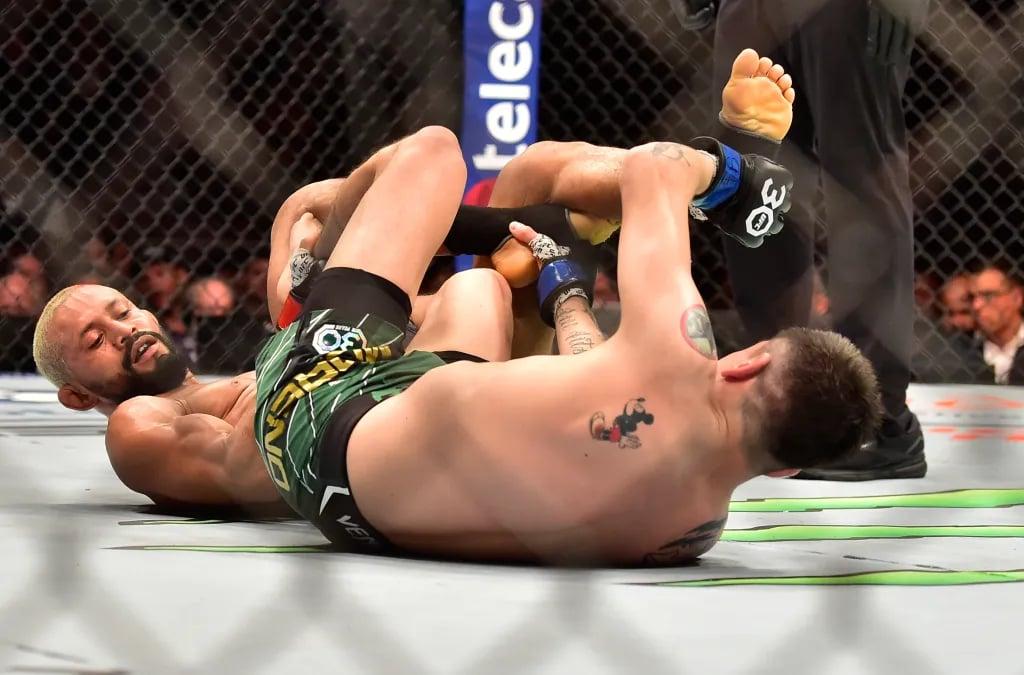 Deiveson Figueiredo and Brandon Moreno grappling in their forth fight at UFC 283. Credits to: Jason da Silva - USA TODAY Sports.