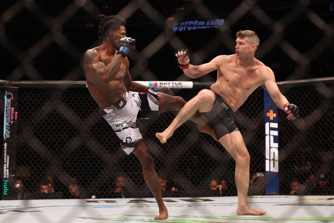 Stephen Thompson striking with Kevin Holland in his last bout. Credits to: Nathan Ray Seebeck - USA TODAY Sports.