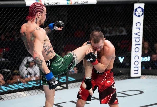Sean O'Malley landing the most significant strike and cuts open Petr Yan with a knee at UFC 280. Credits to: Chris Unger-Zuffa LLC.