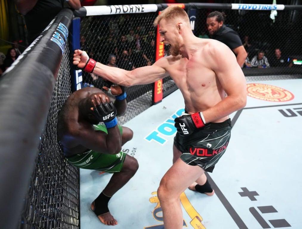 Alexander Volkov lands a finishing sequence on Jairzinho Rozenstruik. Credits to: Chris Unger of Getty Images.