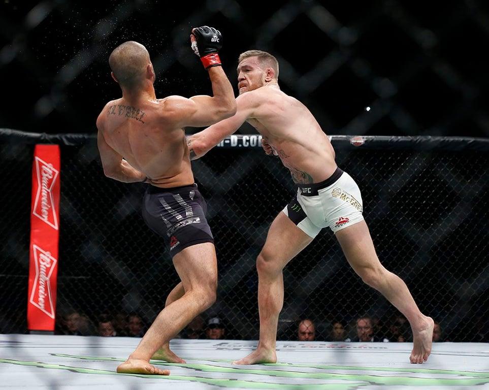 Conor Mcgregor landing a devastating counter shot on Eddie Alvarez inside the MSG Arena at UFC 205. Credits to: Adam Hunger - USA TODAY Sports.