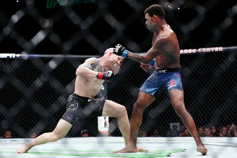 Josh Emmett moments before knocking Michael Johnson unconscious with a huge overhand. Credits to: Bill Streicher - USA TODAY Sports.