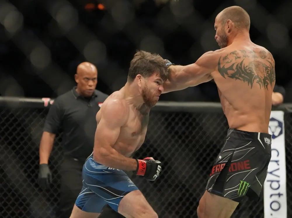 Jim Miller landing on Donald Cerrone in their bout at UFC 276. Credits to: Stephen R. Sylvanie - USA TODAY Sports.
