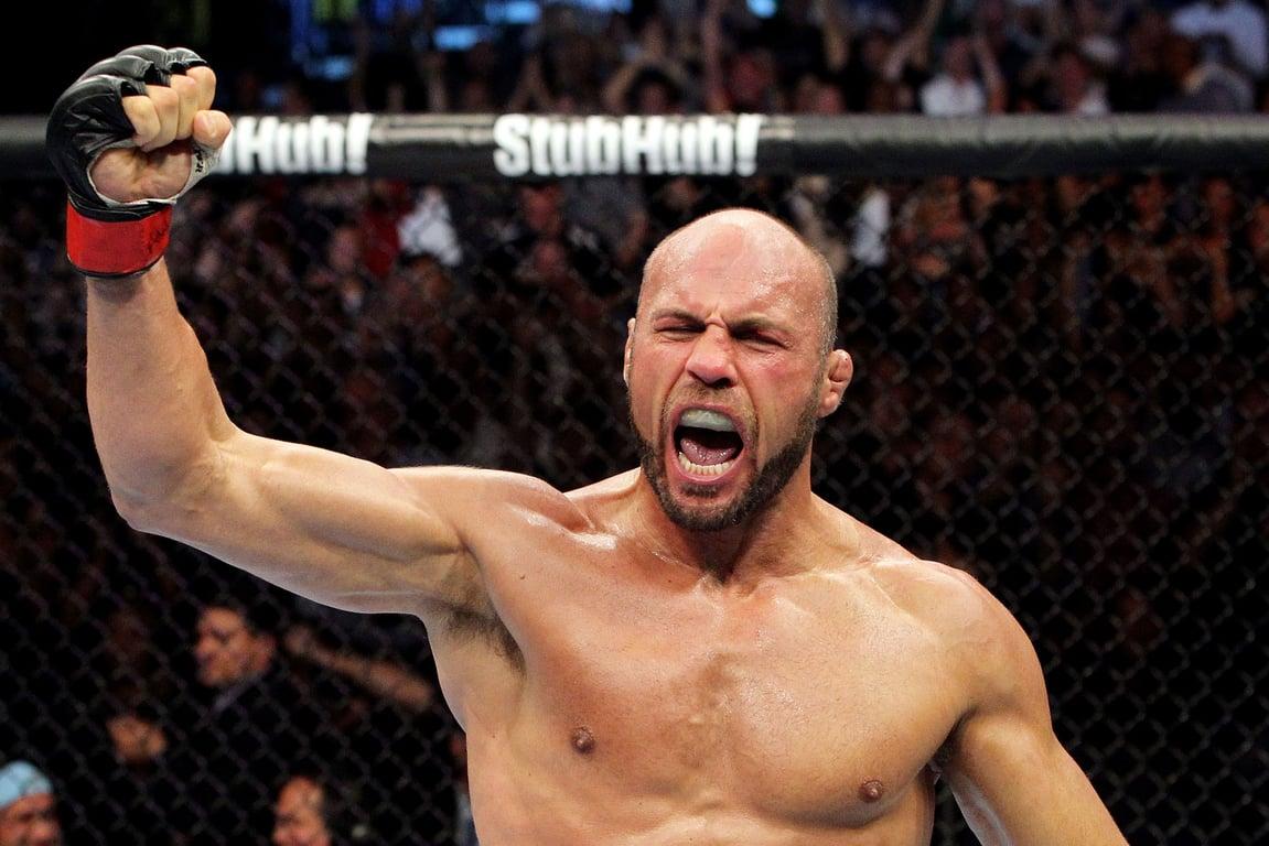 Randy Couture raises his hand in victory. Credits to: Zuffa LLC