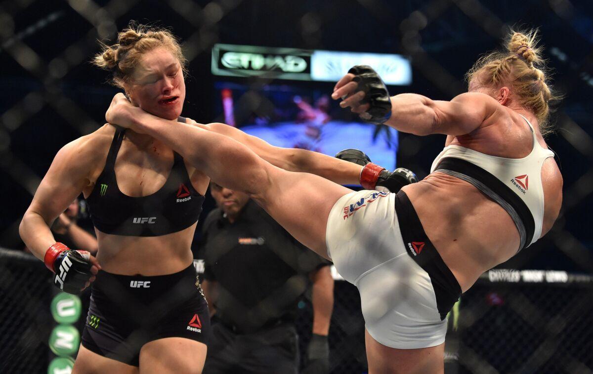 Holly Holm lands her famous headkick on Ronda Rousey. Credit: Zuffa LLC.