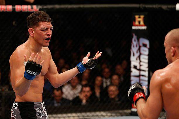 Nick Diaz taunts Georges St-Pierre at UFC 158. Credits to: Josh Hedges-Getty Images.