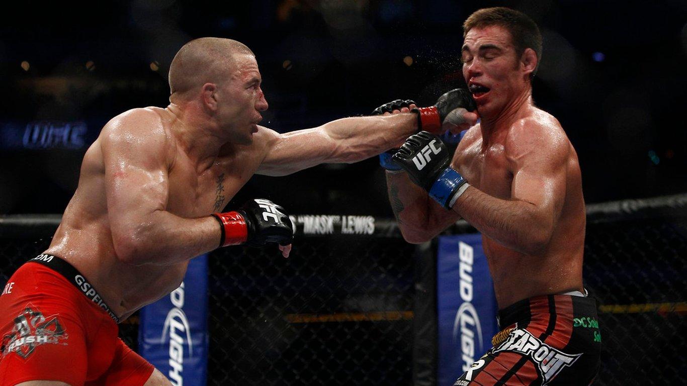 Georges St-Pierre beating Jake Shields at UFC 129. Credits to: Esther Lin - MMA Fighting.