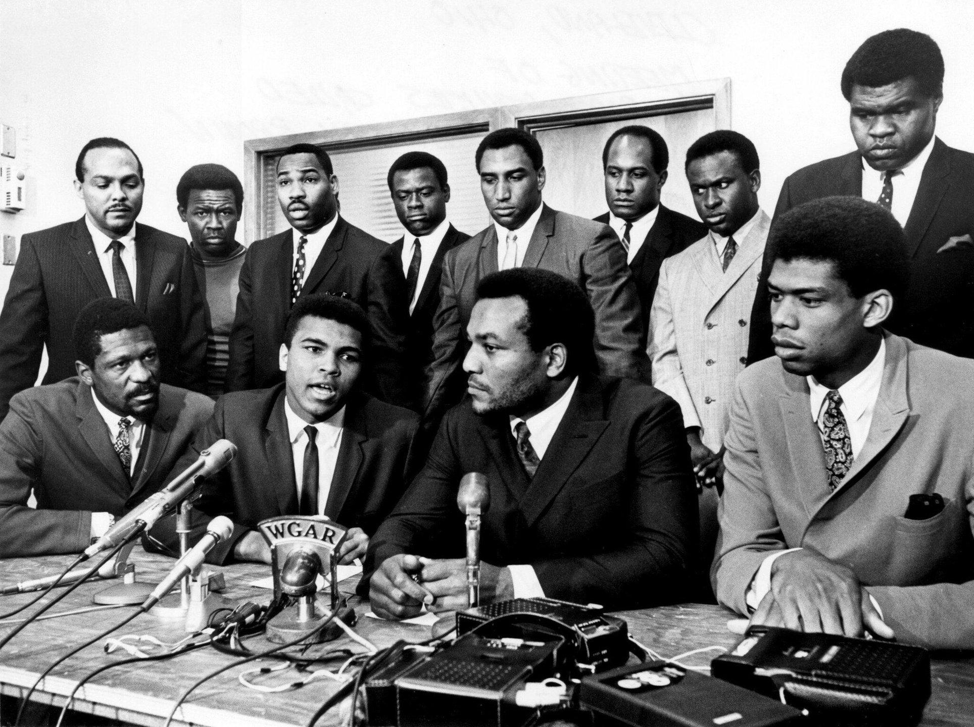 Seated third from the left, Jim Brown brought Bill Russell, Muhammad Ali, Kareem Abdul-Jabbar, and other black athletes together to help support Ali's stances on the Vietnam war. Photo by Tony Tomsic, Associated Press.