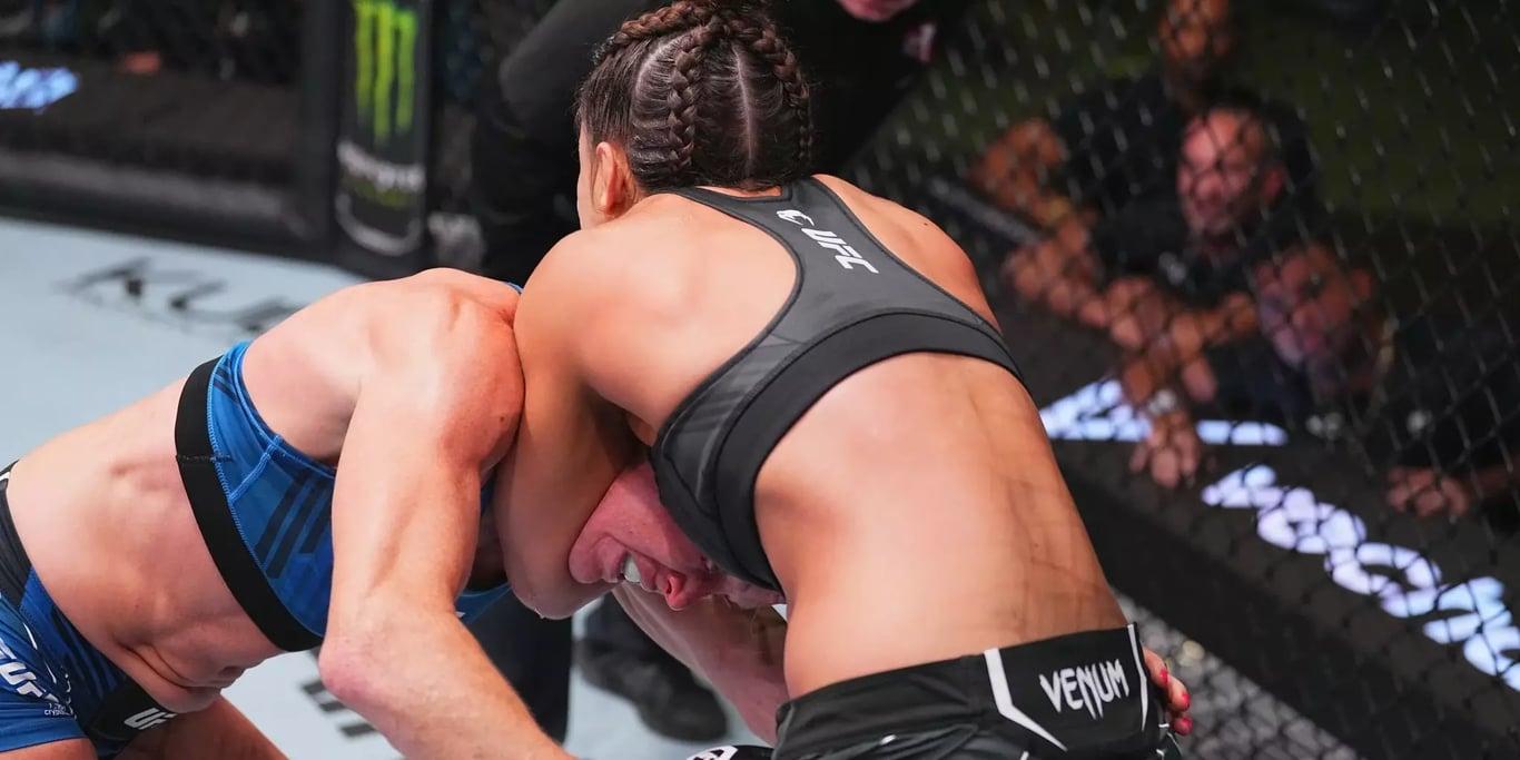 Mayra Bueno Silva choking Holly Holm in her first UFC main event. Credits to: Chris Unger - Zuffa LLC,