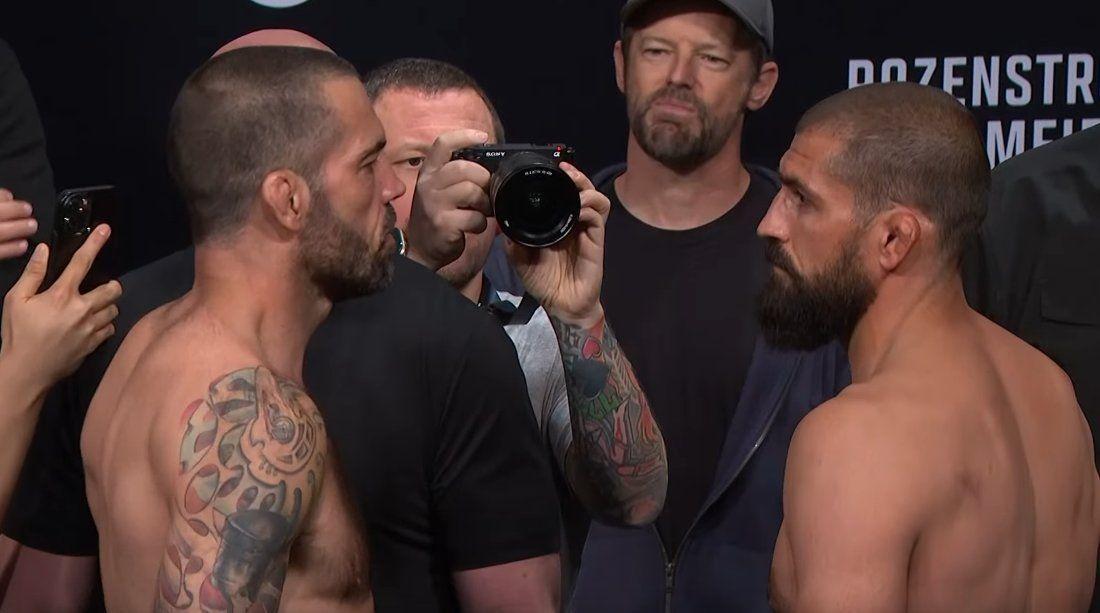 Matt Brown faces off against Court McGee. Photo by Jed I. Goodman.
