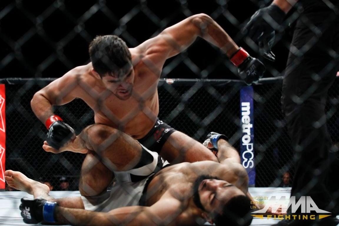 Vicente Luque landing the final blows against Belal Muhammad. (Esther Lin - MMA Fighting)