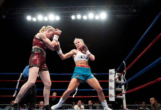 Holly Holm with an lead uppercut against her opponent . Credits to: Steve Snowden-Getty Images.