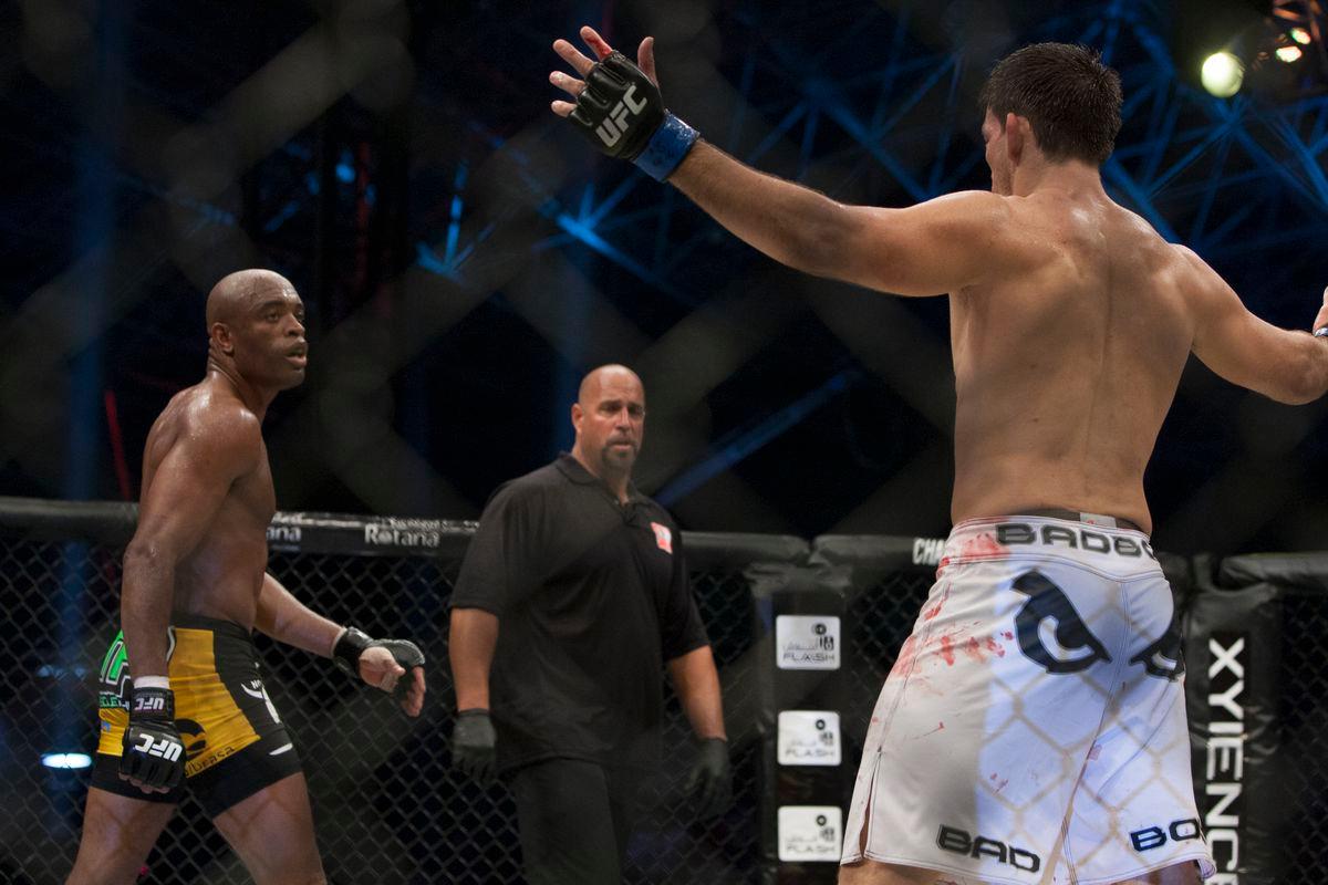 Demian Maia throws his arms up in frustration against a retreating Anderson Silva. Credit: MMA Fighting.