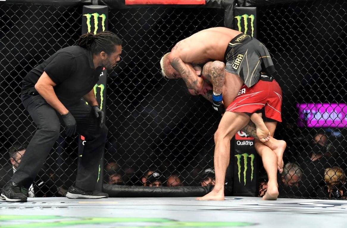 Charles Oliveria chokes out Dustin Poirier to retain his title at UFC 269. Credits to: Chris Unger/Zuffa LLC