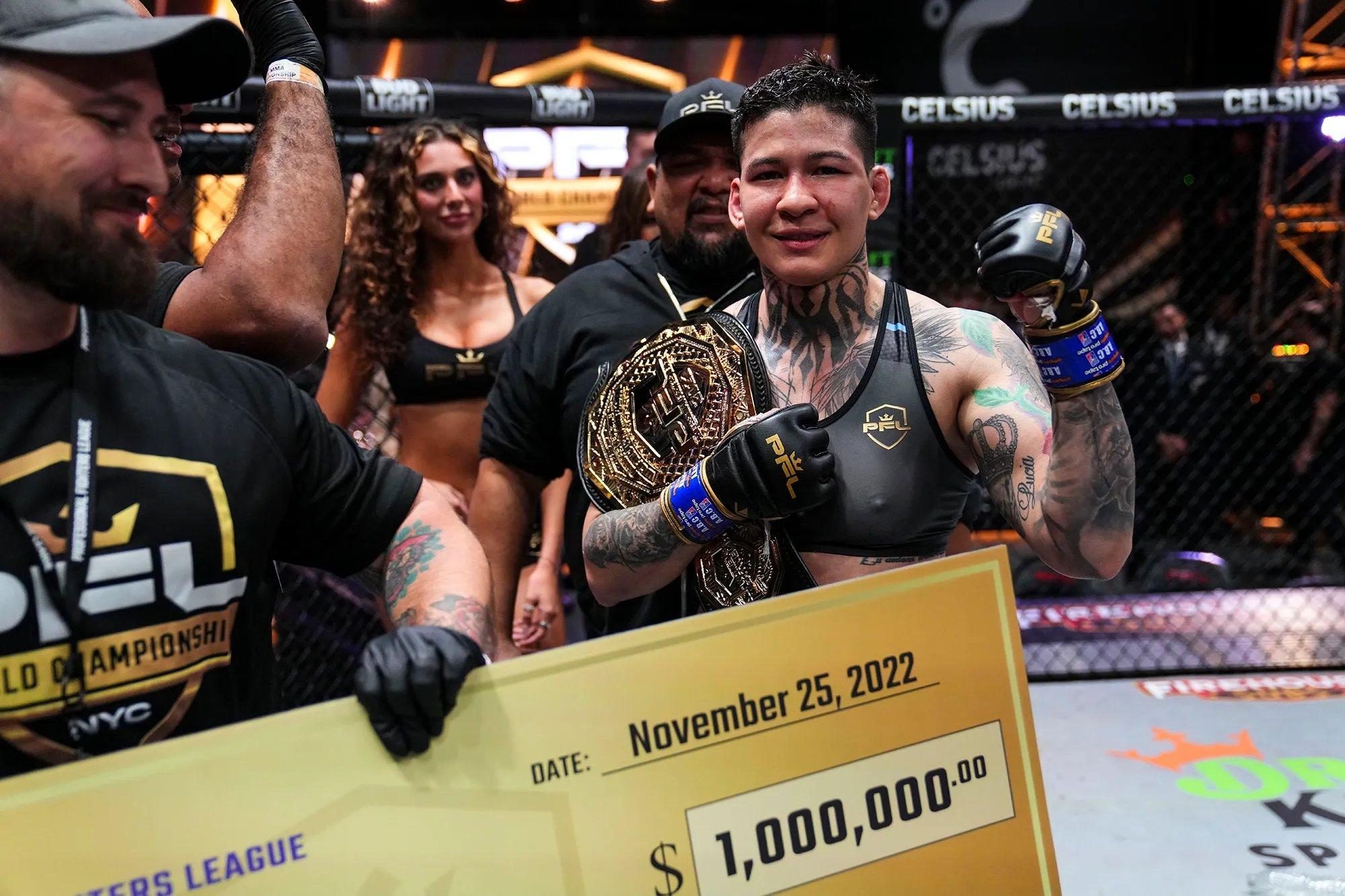 Pacheco with her $1 million check after defeating Kayla Harrison to win the 2022 PFL Finals at Women's Lightweight. Photo by Cooper Neill/PFL.