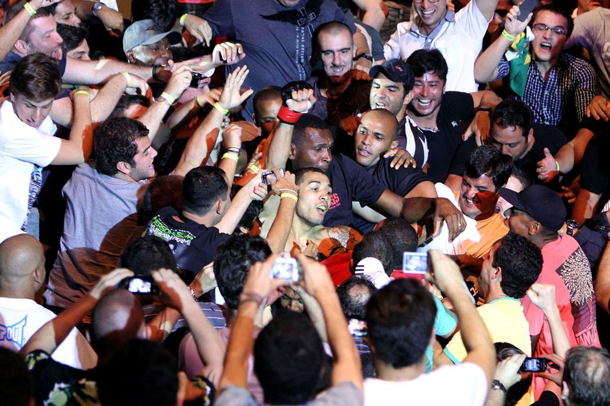 Jose Aldo celebrates with the crowd in Rio de Janeiro after defeating Chad Mendes. Credit: MMA Mania.