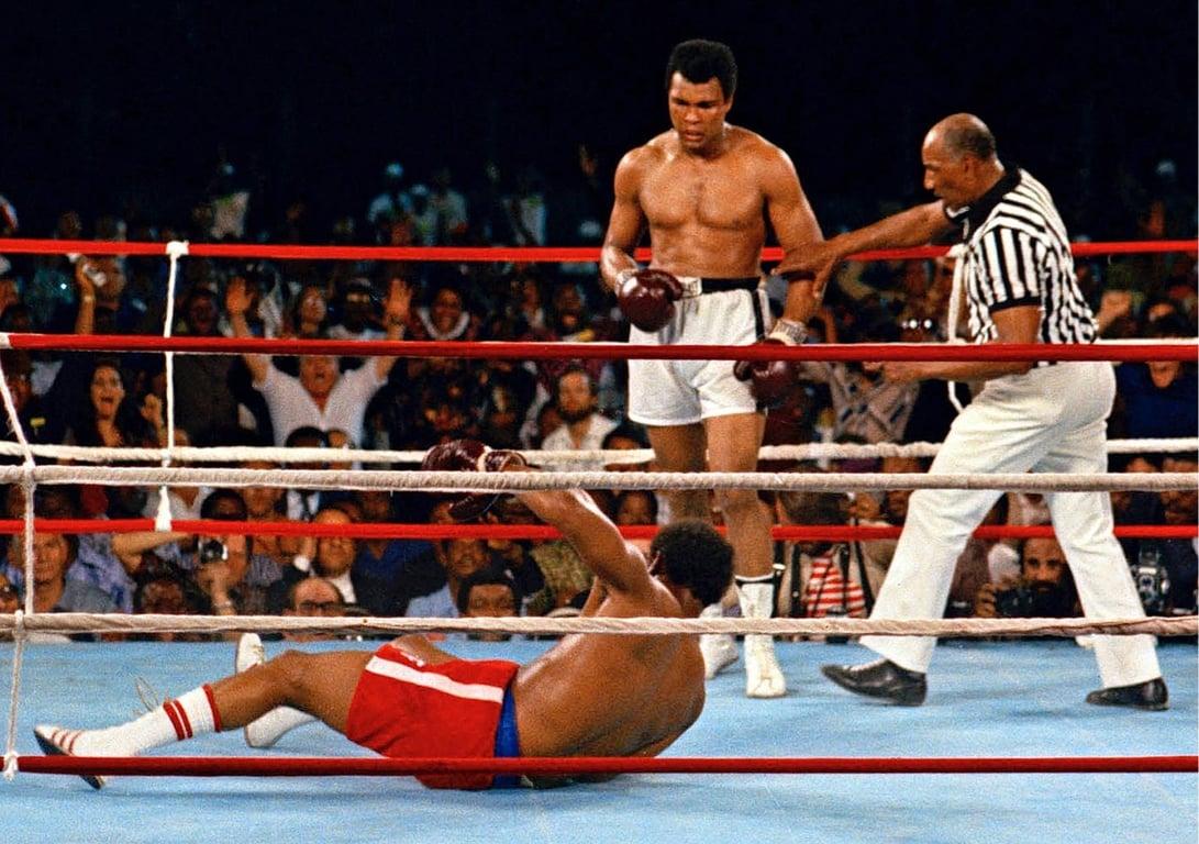 Muhammad Ali after dropping George Foreman at the Rumble in the Jungle in Kinshasa, Zaire. Credits to: AP Photo