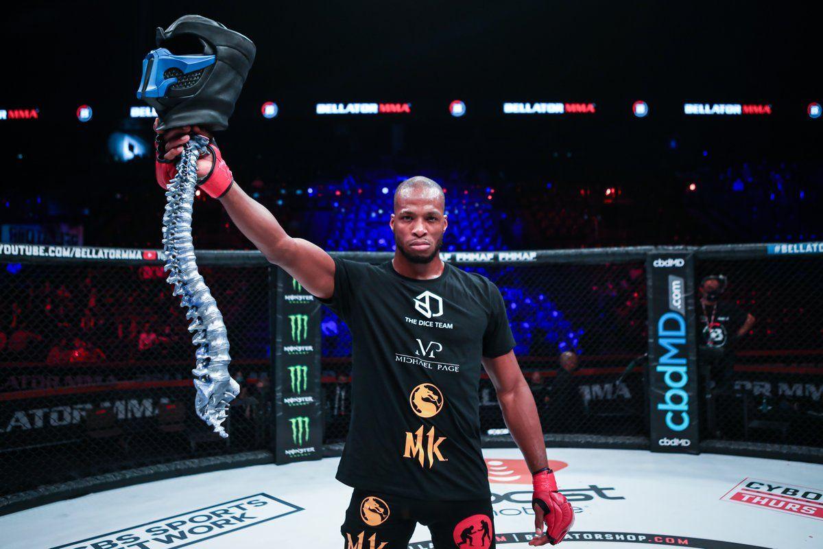 Michael Page does a Mortal Kombat-style victory pose inside the cage. Credit: Bellator MMA.