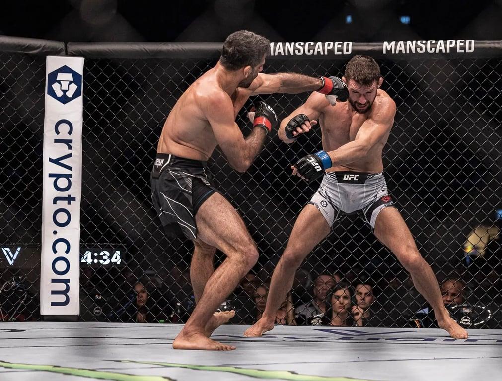 Mateusz Gamrot taking a left straight before dropping a unanimous decision to Beniel Dariush at UFC 280. Credits to: Craig Kidwell - USA TODAY Sports.