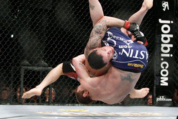 Frankie Edgar and Gray Maynard go to war in one of the greatest fights ever. Credit: Eric Jamison - AP Photo